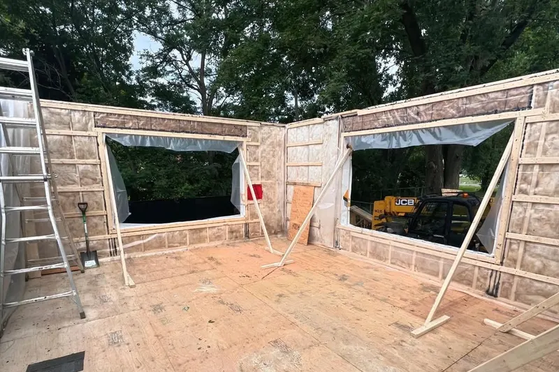 Framing of a residential addition, walls up and insulated