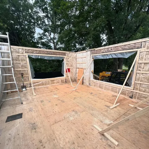 Home addition walls framed, insulated and ready for windows